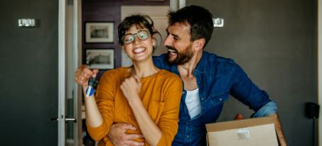 couple who just bought new home with real estate loan